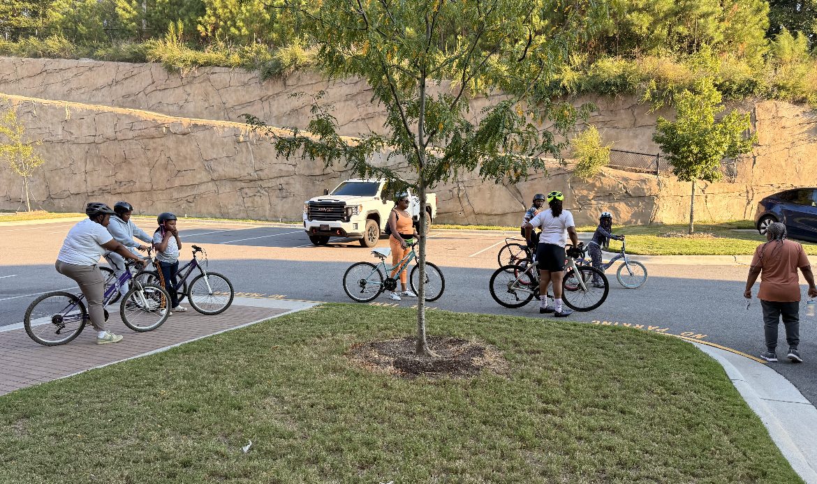Riders line up in the parking lot before heading out